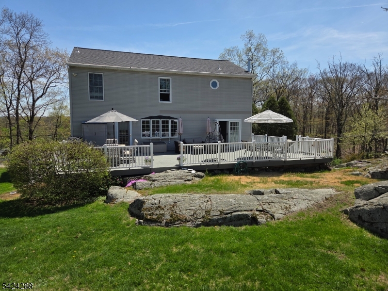 8 Papoose Trail Hopatcong, NJ 07821 - Photo 2 of 38 a front view of house with yard and outdoor seating