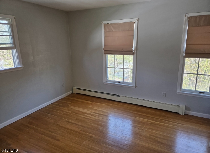 8 Papoose Trail Hopatcong, NJ 07821 - Photo 25 of 38 an empty room with wooden floor and windows