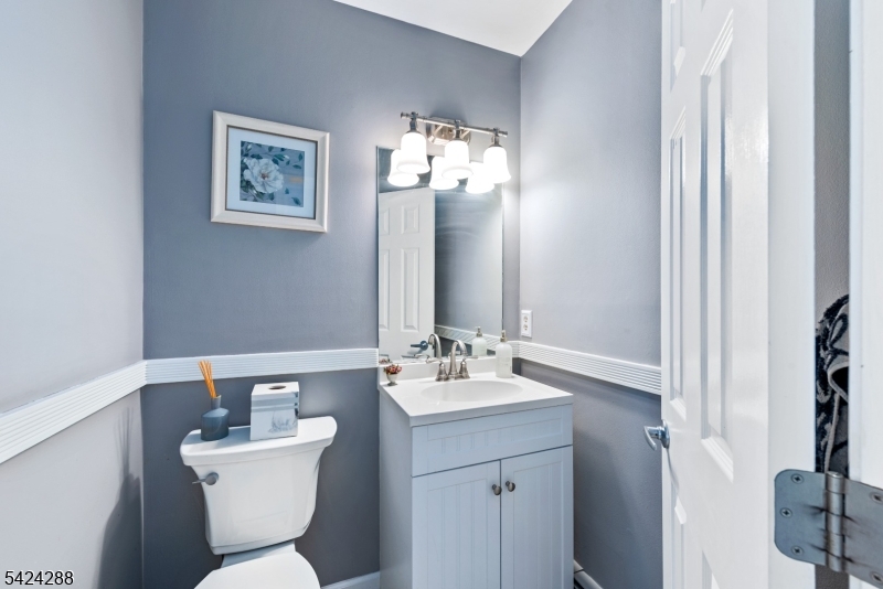 8 Papoose Trail Hopatcong, NJ 07821 - Photo 29 of 38 a bathroom with a toilet sink and mirror