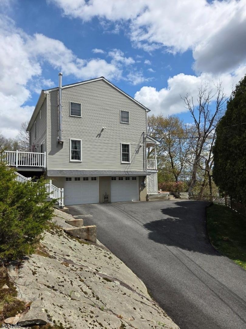 8 Papoose Trail Hopatcong, NJ 07821 - Photo 3 of 38 a view of a house with a yard