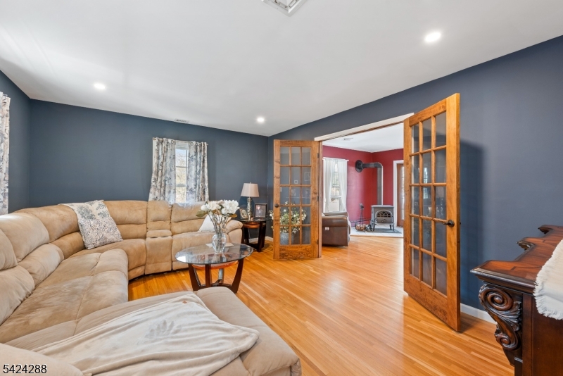 8 Papoose Trail Hopatcong, NJ 07821 - Photo 9 of 38 a living room with furniture and a wooden floor