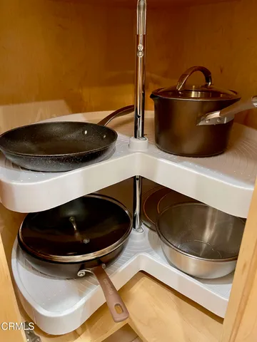 a view of a hallway with closet and utility room