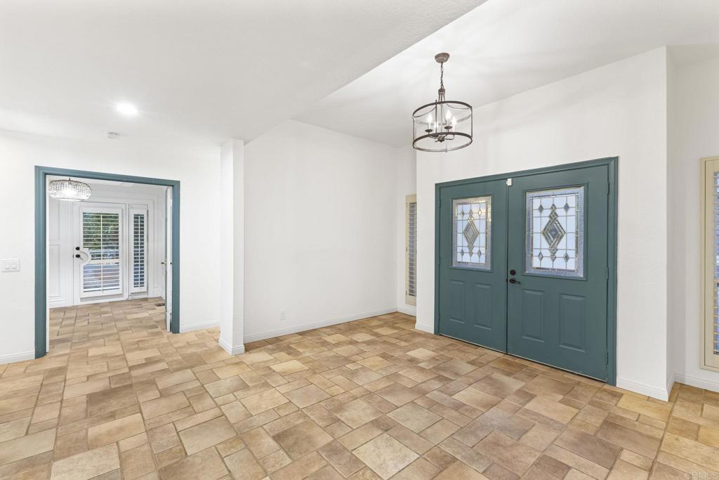 28720 Sandhurst Way Escondido, CA 92026 - Photo 15 of 57 a bedroom with a bed and cabinets