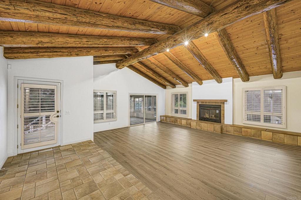 28720 Sandhurst Way Escondido, CA 92026 - Photo 17 of 57 a view of an empty room with wooden floor and a window