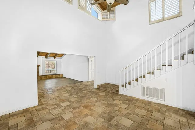 a kitchen with stainless steel appliances granite countertop kitchen island a stove and a sink