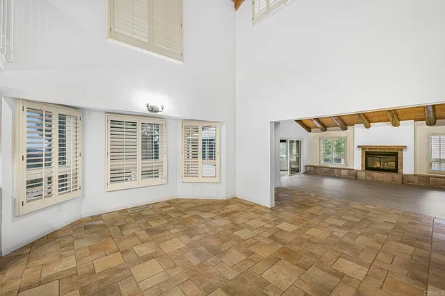 a view of a kitchen with kitchen island a sink a counter top space and stainless steel appliances