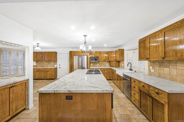 en empty room with wooden floor and windows