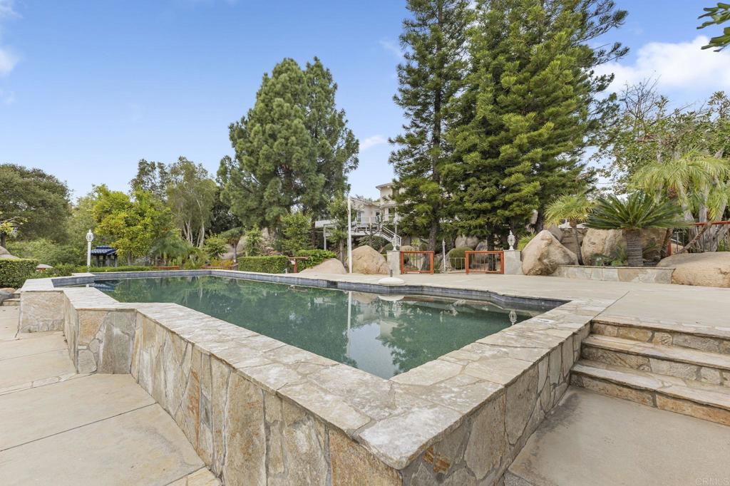 28720 Sandhurst Way Escondido, CA 92026 - Photo 3 of 57 a view of a swimming pool with a patio