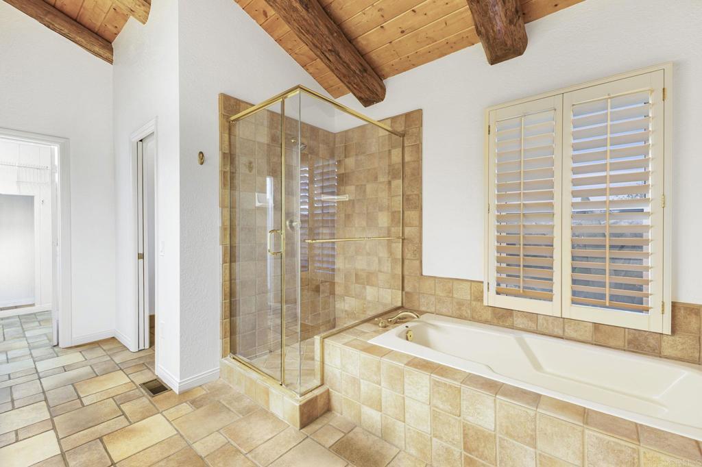 28720 Sandhurst Way Escondido, CA 92026 - Photo 38 of 57 a spacious bathroom with a bathtub and a shower