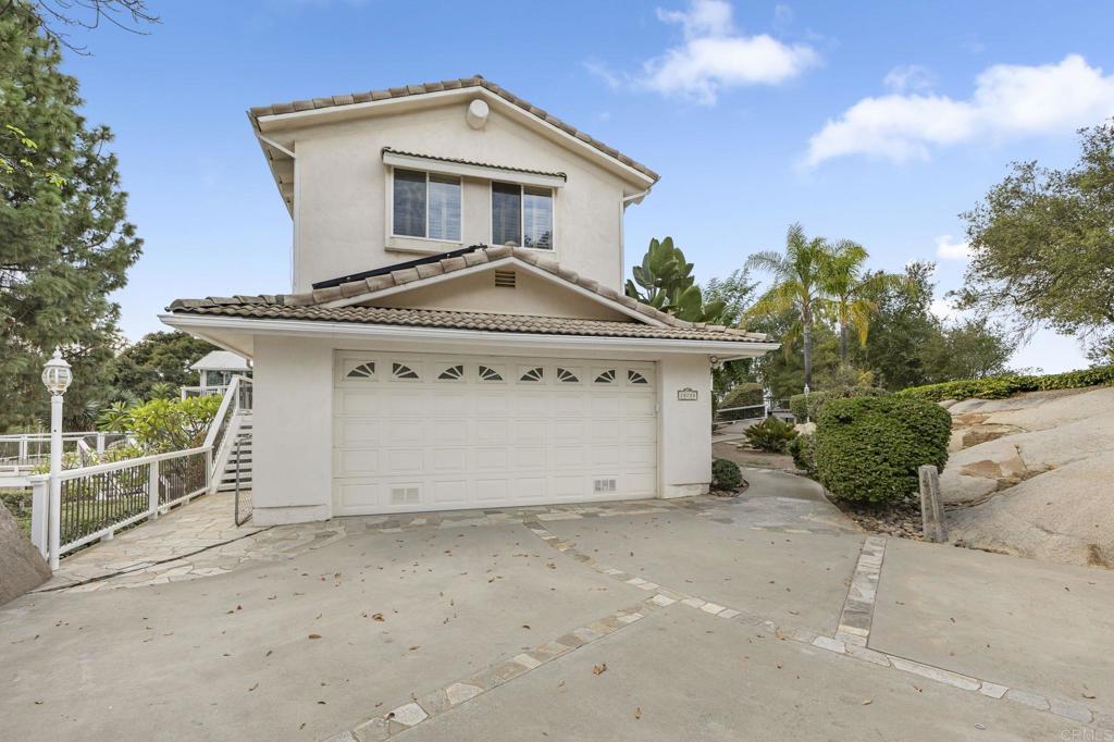 28720 Sandhurst Way Escondido, CA 92026 - Photo 49 of 57 a view of a house with a yard and garage