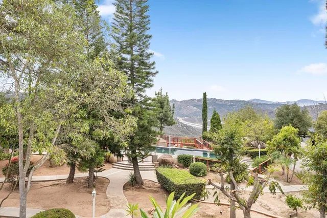 a view of a balcony with wooden fence