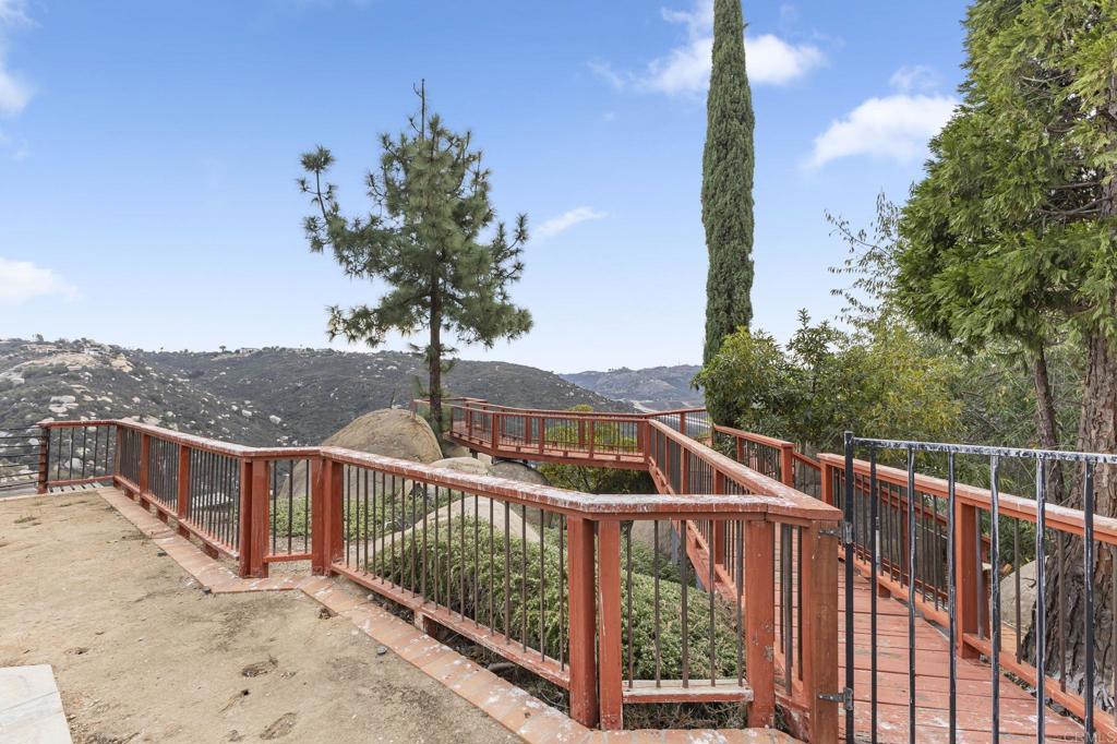 28720 Sandhurst Way Escondido, CA 92026 - Photo 6 of 57 a view of a balcony with wooden fence