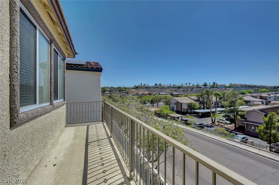 977 Sparkling Light Street Henderson, NV 89052 - Photo 59 of 75 Enjoy expansive neighborhood views from this inviting private balcony.