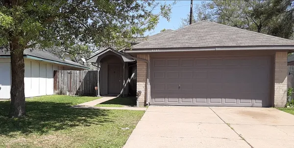a house with yard in front of it