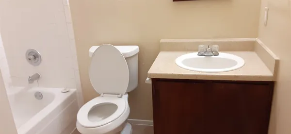 a view of a hallway with a door