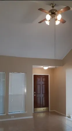 a view of a chandelier fan in a room