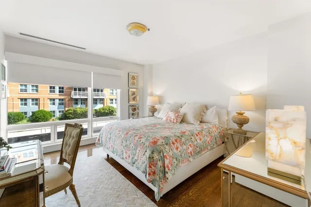 a bedroom with bed and window