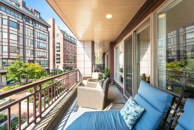 a view of balcony with furniture