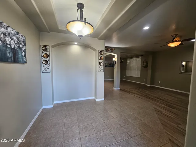 a view of a hallway with a chandelier