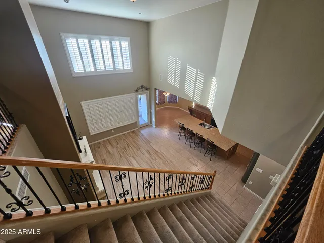 a bathroom with a sink a toilet a mirror and shower