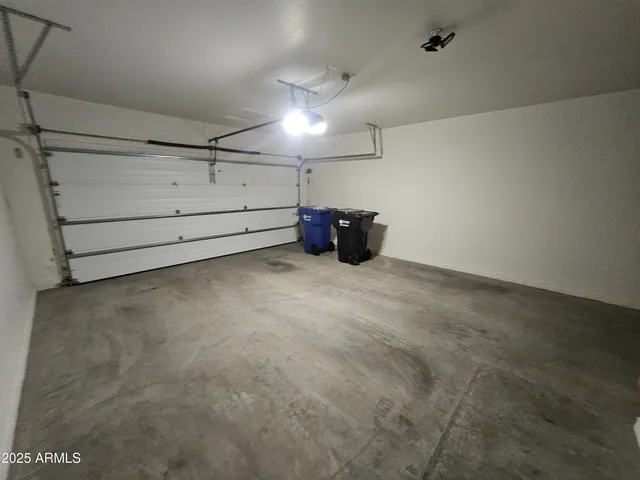 a view of a backyard with table and chairs a fire pit and grass
