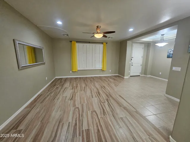 a view of an empty room with glass door