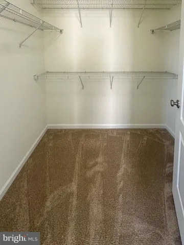 a bathroom with a sink double vanity and a mirror