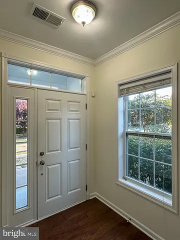 a view of walk in closet with empty room