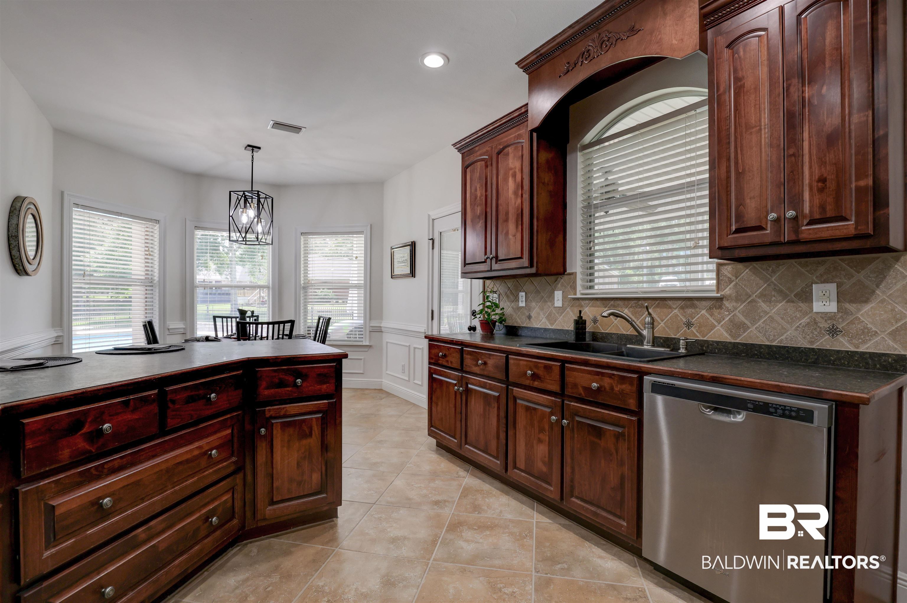 5565 Dawes Lane Theodore, AL 36582 - Photo 10 of 38 Kitchen with light tile patterned floors, dishwasher, tasteful backsplash, and sink