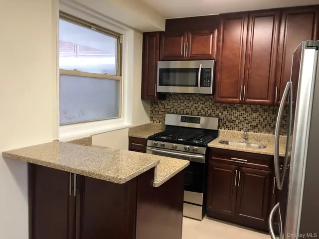 a kitchen with a stove and a microwave