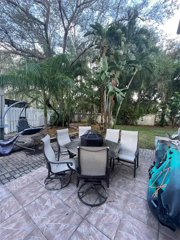 a view of a patio with couple of chairs