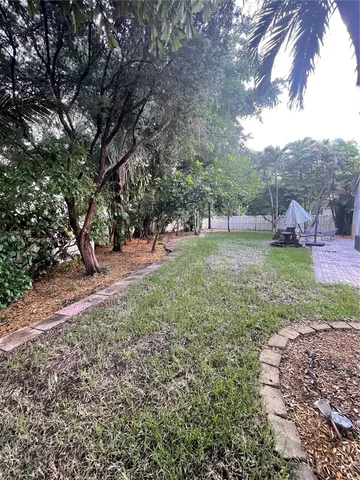 a backyard of a house with lots of green space