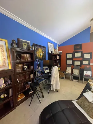 a view of a livingroom with furniture and a window