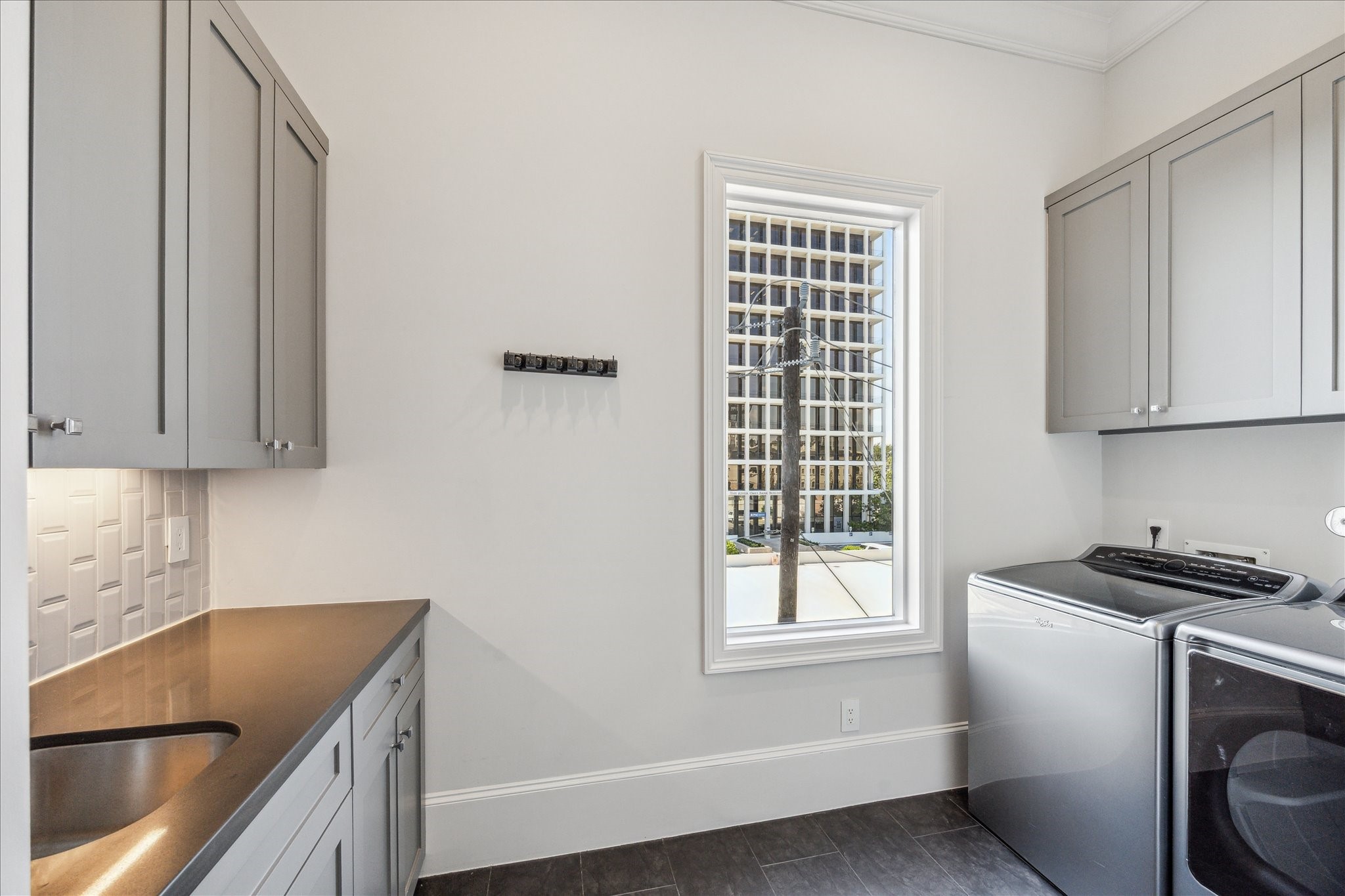 2103 Argonne Street, Unit B Houston, TX 77019 - Photo 14 of 28 Utility room with sink and storage located on 3rd floor.