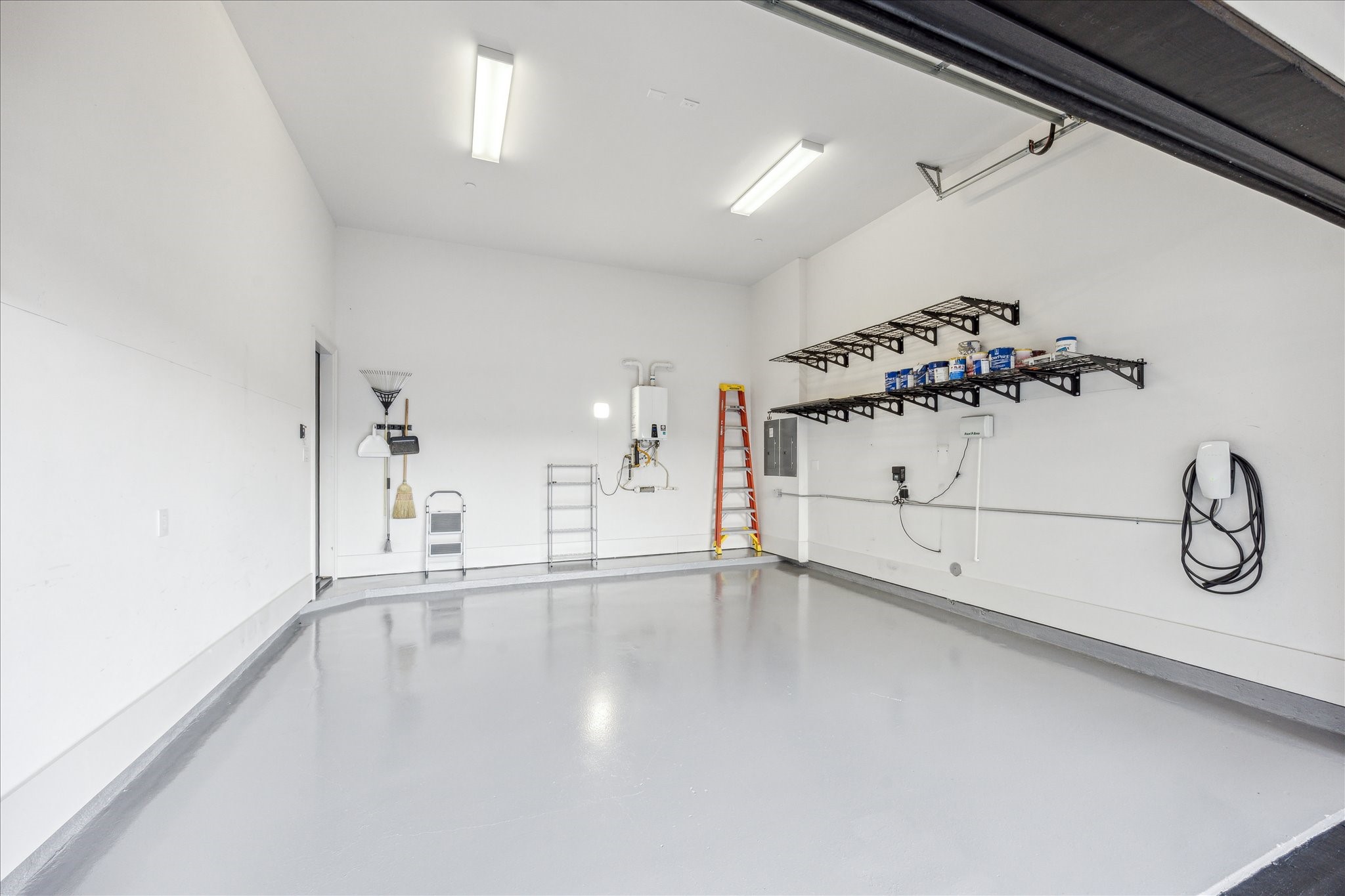 2103 Argonne Street, Unit B Houston, TX 77019 - Photo 27 of 28 Oversized two car garage has a Tesla charging system and has height for a lift.