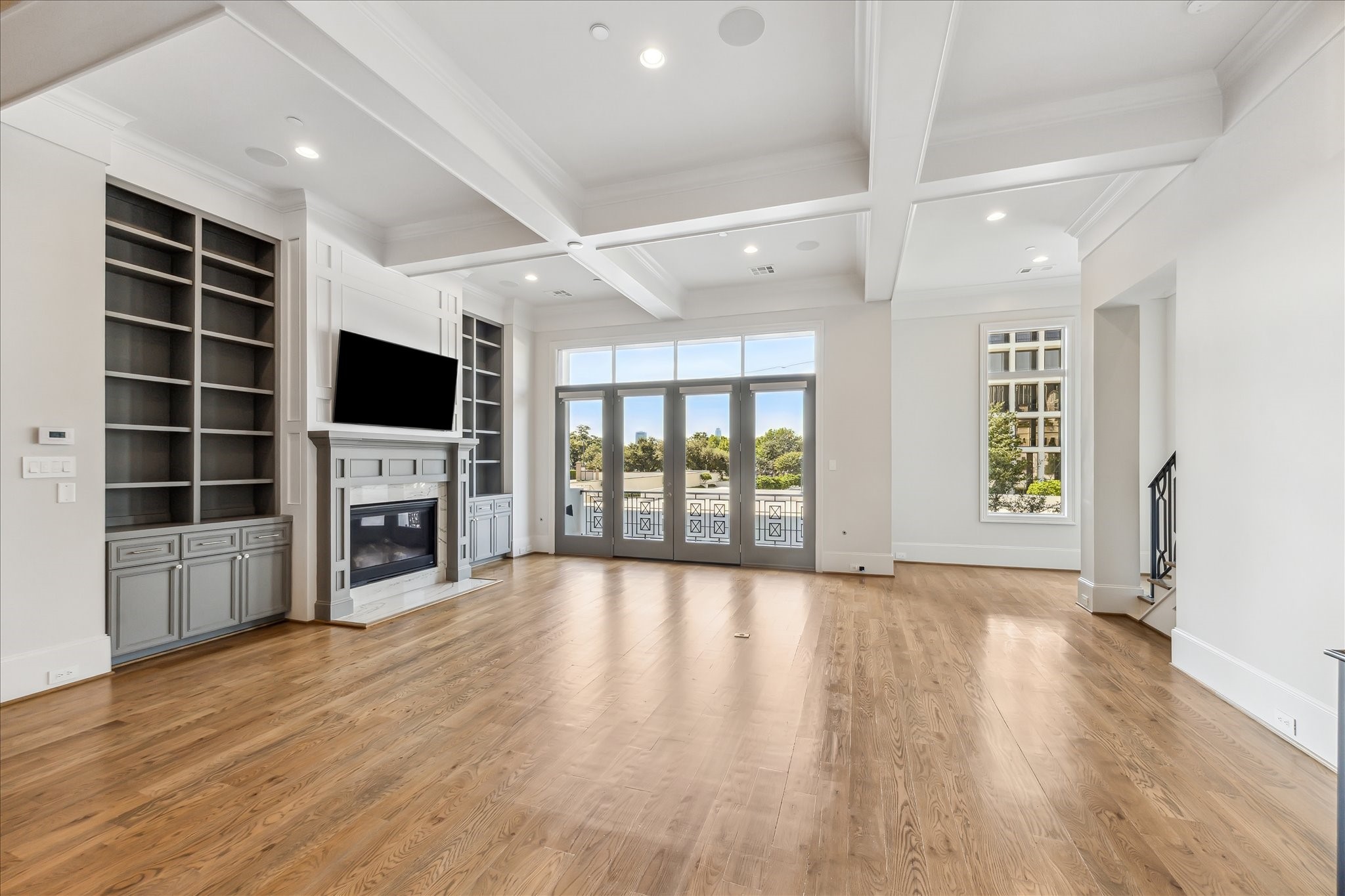 2103 Argonne Street, Unit B Houston, TX 77019 - Photo 7 of 28 2nd floor features large living room space with fireplace and large built ins.