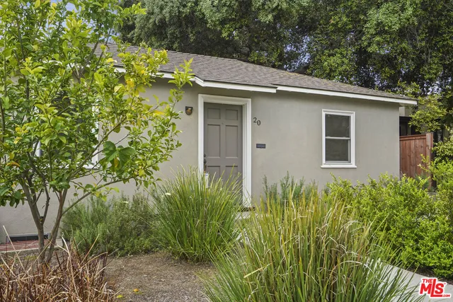 a view of a house with a plant