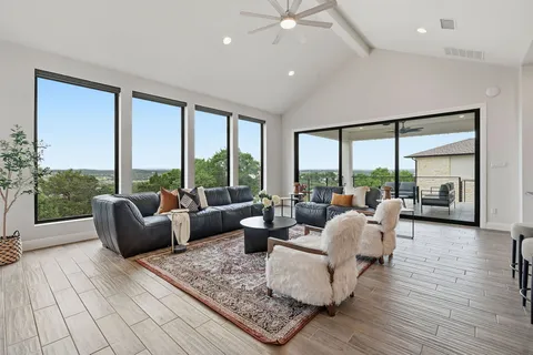 a living room with furniture and a large window