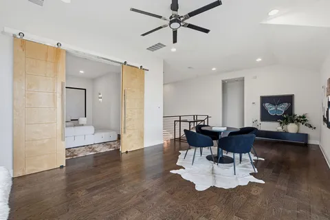 a view of a dining room with furniture and wooden floor