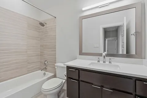 a bedroom with bed and a window