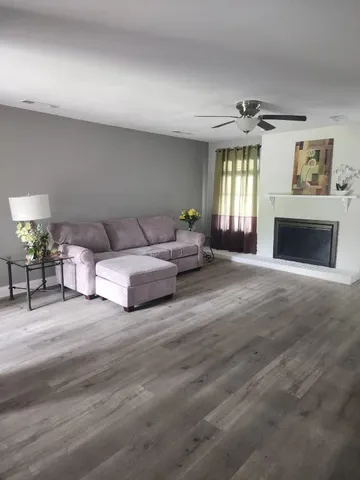 a spacious bedroom with a bed and a fireplace