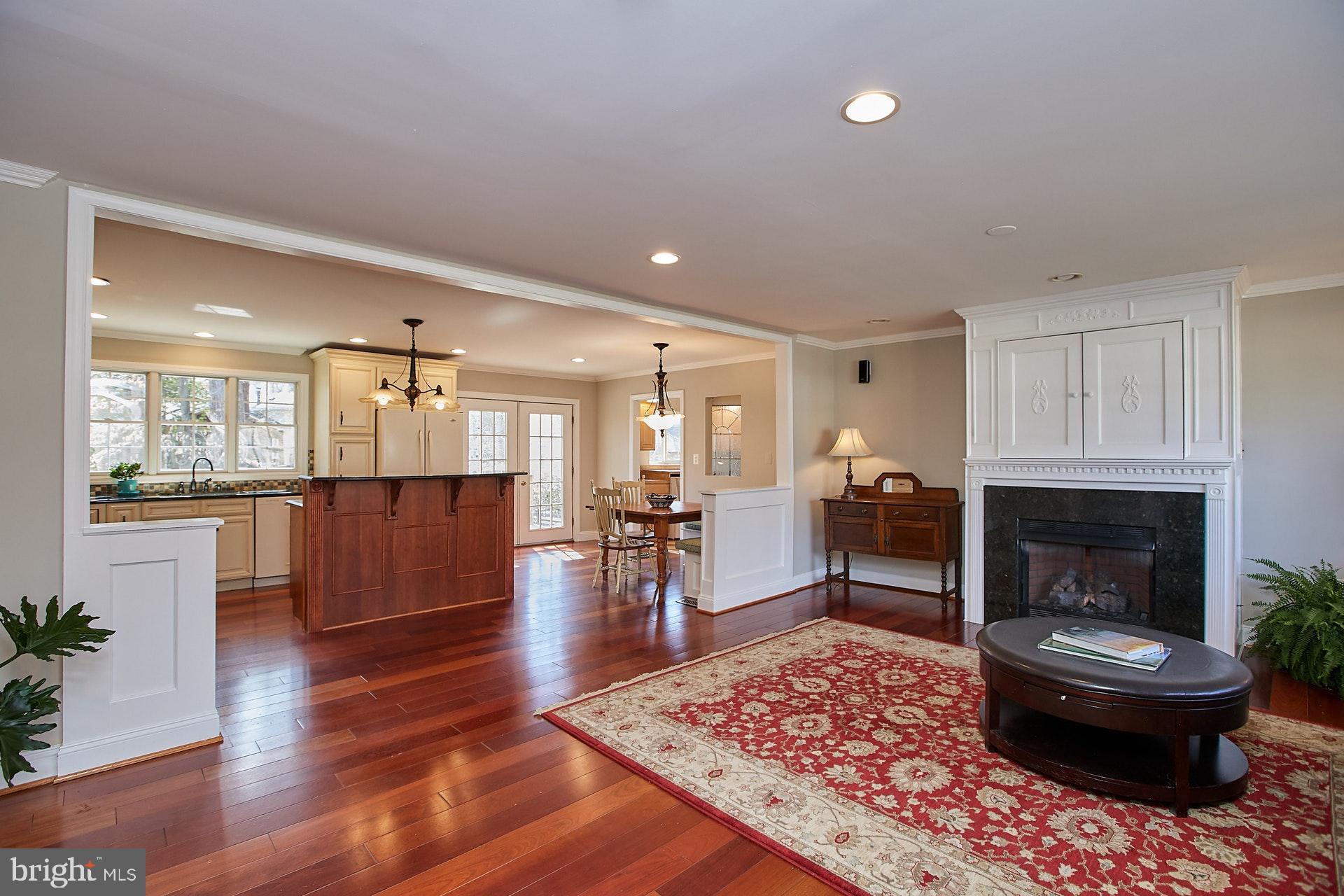 5536 Queensberry Avenue Springfield, VA 22151 - Photo 4 of 34 Great room w/gas fireplace and gleaming hardwoods