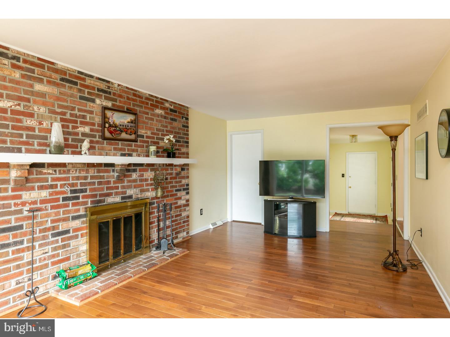 151 Antietam Road Delran, NJ 08075 - Photo 11 of 24 a living room with a flat screen tv and a fireplace