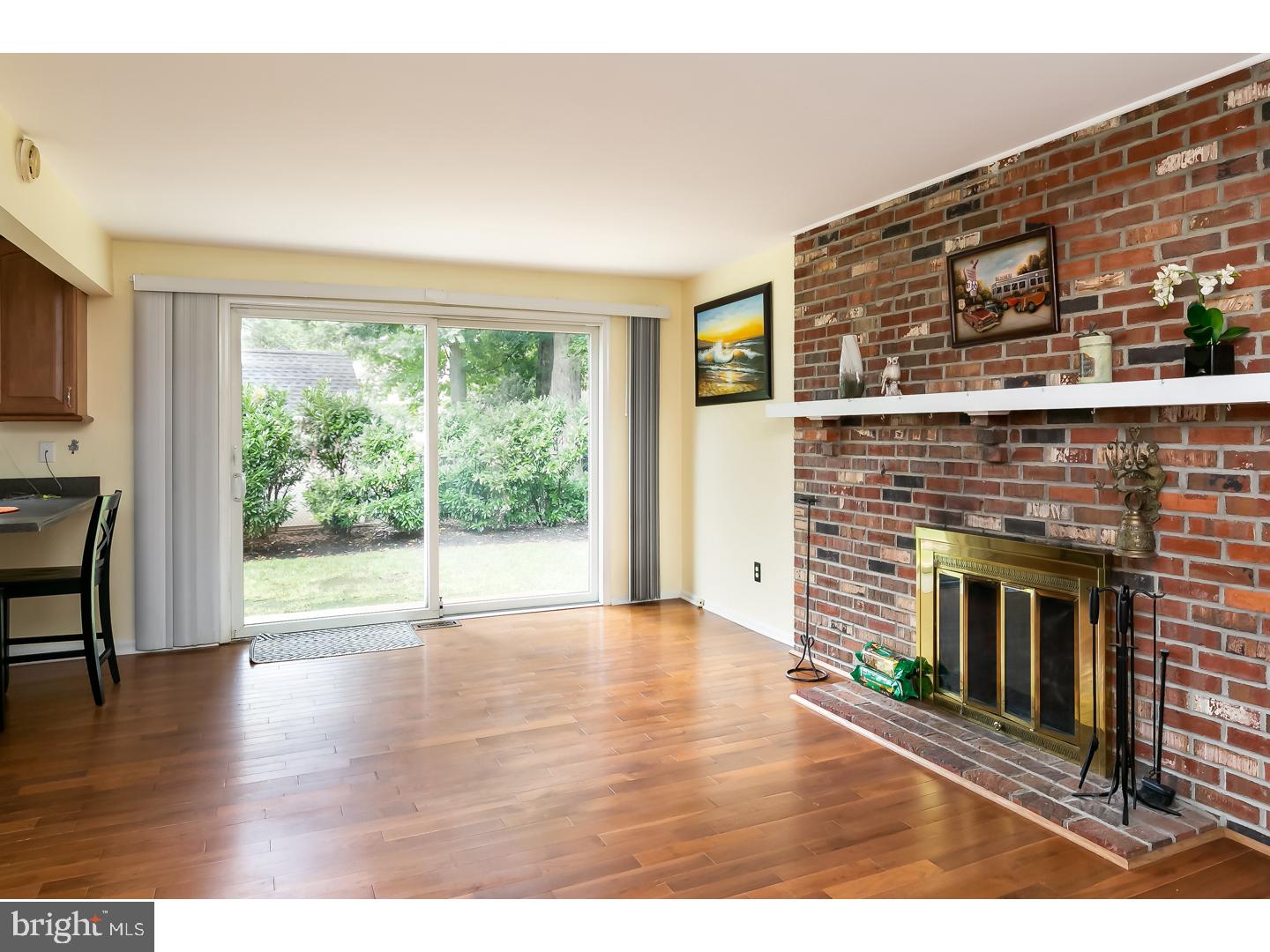 151 Antietam Road Delran, NJ 08075 - Photo 12 of 24 a view of an empty room with wooden floor fireplace and a window
