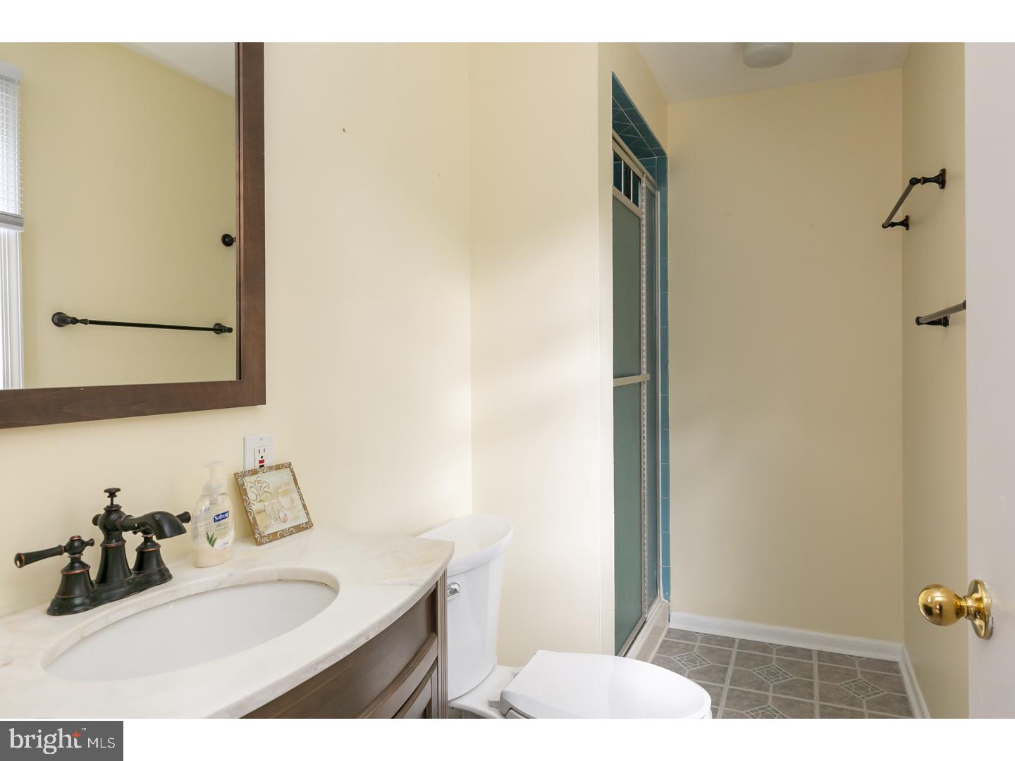 151 Antietam Road Delran, NJ 08075 - Photo 17 of 24 a bathroom with a sink and a mirror