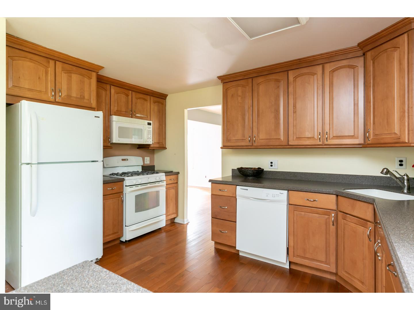 151 Antietam Road Delran, NJ 08075 - Photo 6 of 24 a kitchen with a refrigerator stove top oven and sink