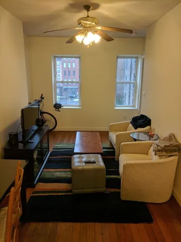 a living room with furniture and a window