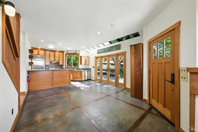 a kitchen with stainless steel appliances granite countertop a stove and a refrigerator