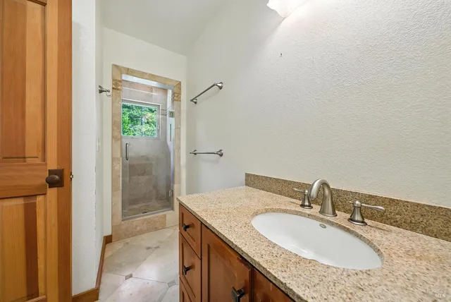 a view of an empty room with windows