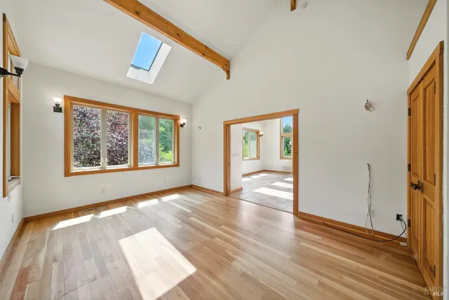 a spacious bathroom with a granite countertop tub sink and mirror